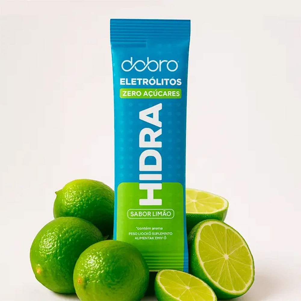 Sachê de eletrólitos em pó HIDRA Dobro sabor limão, zero açúcar, com limões ao redor.