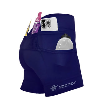 Shorts de compressão feminina azul marinho, em foco bolsos laterais.