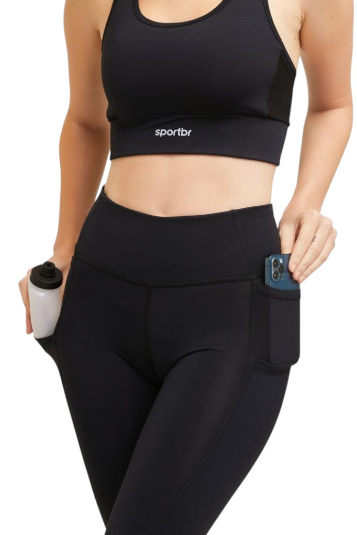 Calça de compressão preta SPORTBR com bolsos laterais, cós alto e tecido tecnológico de alta performance.