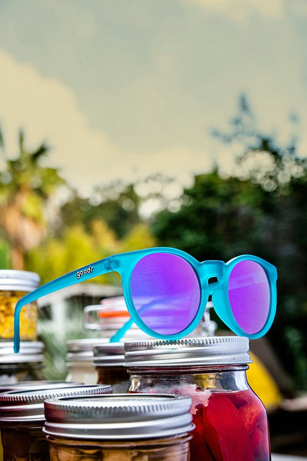 Óculos de sol SPORTBR Goodr Circle G com armação verde e lentes espelhadas roxas, ideal para corrida.
